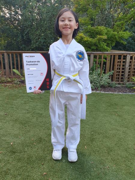Lily achieves a credit pass at senior taekwondo grading